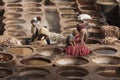 FEZ, MOROCCO Ã¢â¬â FEBRUARY 20, 2017 : Men working at the famous Chouara Tannery in the medina of Fez, Morocco Royalty Free Stock Photo